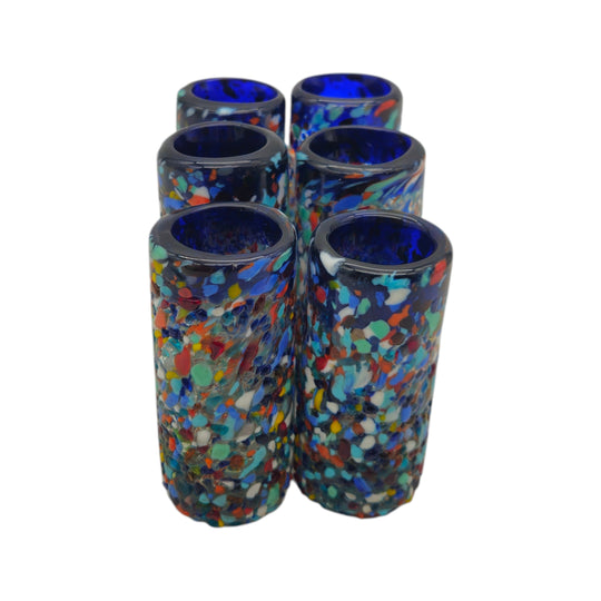 The Talavera Hub hand-blown confetti shot glasses with blue rims and multicolor flecks. Set of 6.