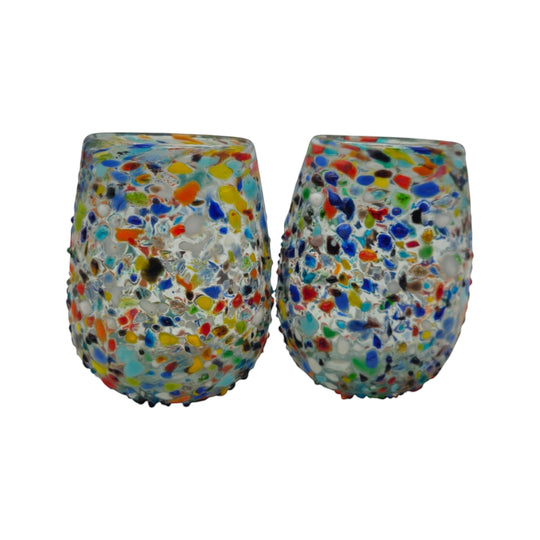 The Talavera Hub hand-blown stemless wine glasses with colorful confetti pattern and pebbled texture. Set of 2, 12 oz capacity.