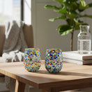 The Talavera Hub hand-blown stemless wine glass with colorful confetti pattern and pebbled texture. Holds 12 oz.