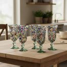 The Talavera Hub hand-blown Mexican sundae glasses with confetti rock design in red, blue, orange, and green speckles. Flared rim, pedestal base, recycled glass.