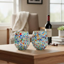 The Talavera Hub XL stemless wine glasses with colorful confetti rock design, made of lead-free glass.