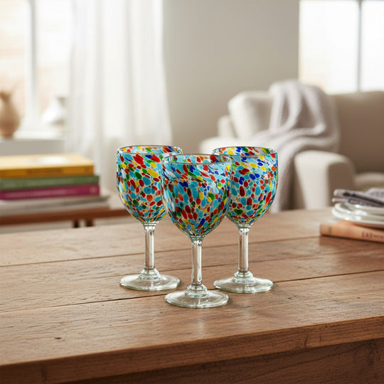 The Talavera Hub hand-blown wine glasses with multicolor confetti design. Lead-free glass, 12 oz capacity.