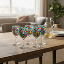 The Talavera Hub hand-blown wine glasses with multicolor confetti design. Lead-free glass, 12 oz capacity.