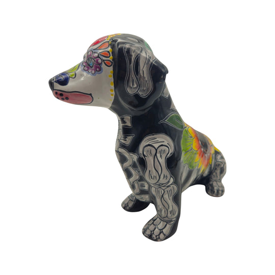 The Talavera Hub black ceramic dachshund figurine with Day of the Dead floral and skeletal motifs.
