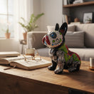 The Talavera Hub Day of the Dead French Bulldog statue, ceramic, hand-painted with vibrant colors and floral designs.