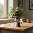The Talavera Hub Day of the Dead lady planter with sugar skull face, braided hair, and white bunny. Hand-painted ceramic.
