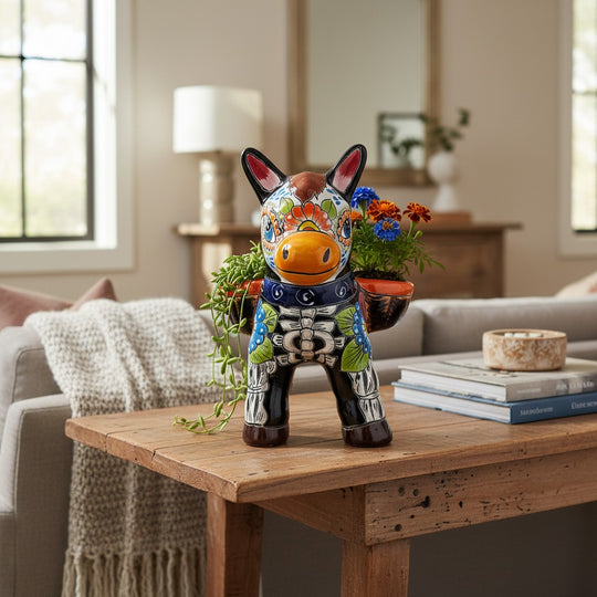 The Talavera Hub colorful ceramic donkey planter with Day of the Dead art, featuring floral motifs and skeleton details.