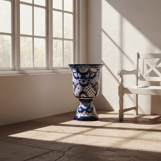 The Talavera Hub extra large blue and white hand-painted Talavera pedestal planter with intricate floral patterns.