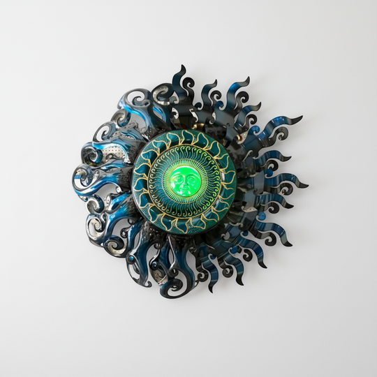 The Talavera Hub Giant Sun Wall Art, handmade metalwork with a green illuminated face and blue/silver swirling rays.
