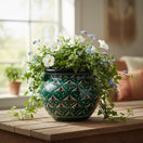 The Talavera Hub green peacock Talavera flower pot with intricate floral motifs, 10" tall, 12" wide.