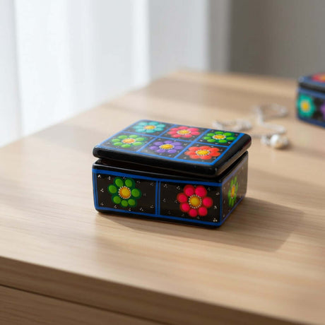 The Talavera Hub handcrafted ceramic Guerrero jewelry box with vibrant hand-painted floral patterns on a black background.