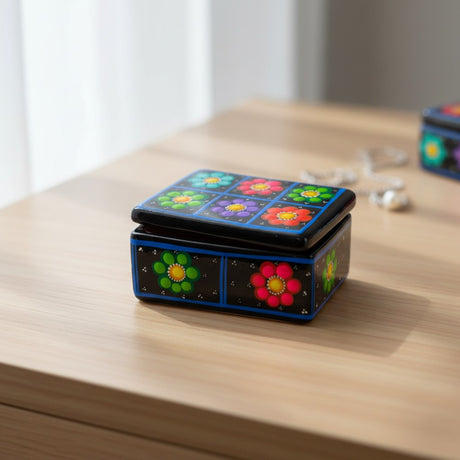 The Talavera Hub handcrafted ceramic Guerrero jewelry box with vibrant hand-painted floral patterns on a black background.