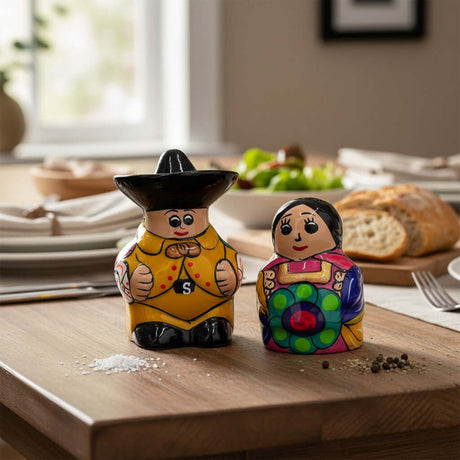 The Talavera Hub hand-painted Guerrero salt and pepper shakers, a couple in traditional Mexican attire.