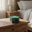 The Talavera Hub Guerrero star-shaped ceramic jewelry box with vibrant hand-painted floral motifs on a wooden nightstand