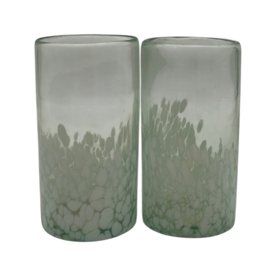 The Talavera Hub hand-blown Mexican highball glass with clear top and white pebble pattern base. Recycled glass.