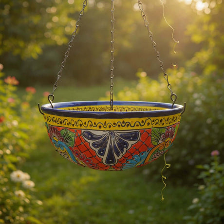 The Talavera Hub hand-painted Mexican ceramic hanging planter with vibrant floral patterns and metal chain