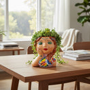 The Talavera Hub hand-painted ceramic lady planter with braided hair, green eyes, and butterfly motif. Mexican folk art.