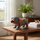 The Talavera Hub handmade gray bulldog statue with colorful floral Talavera patterns and blue eyes.