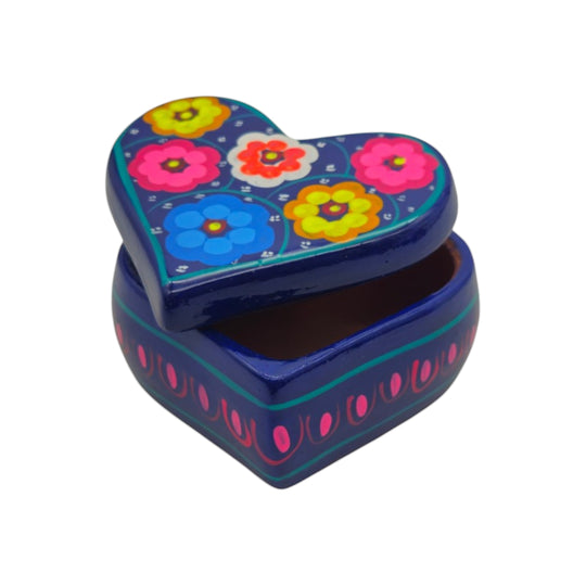 The Talavera Hub hand-painted heart-shaped ceramic jewelry box with vibrant floral patterns on a dark blue background.
