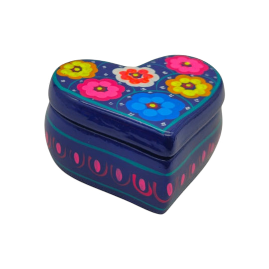 The Talavera Hub heart-shaped ceramic jewelry box with hand-painted blue base and vibrant floral patterns.