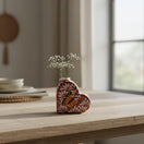 The Talavera Hub brown and white heart-shaped ceramic vase with a hand-painted butterfly design and delicate white flowers.