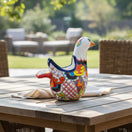 The Talavera Hub large ceramic dove planter, hand-painted with vibrant floral and geometric patterns in blue, orange, red, and yellow.