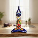 The Talavera Hub large blue ceramic frog statue in yoga pose, hand-painted with colorful flowers and butterflies.