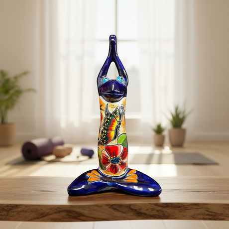 The Talavera Hub large blue ceramic frog statue in yoga pose, hand-painted with colorful flowers and butterflies.