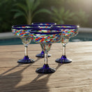 The Talavera Hub Blue Confetti Rock Hand-Blown Margarita Glasses (Set of 4) - Vibrant, unique glassware for cocktails.