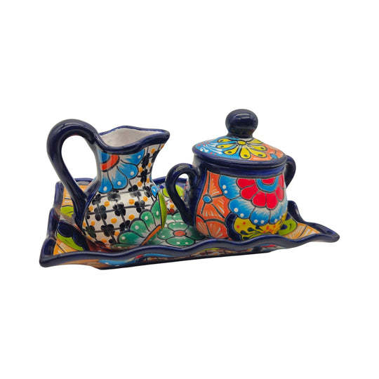 The Talavera Hub 3-piece Mexican ceramic coffee set with hand-painted floral patterns in blue, yellow, and red.