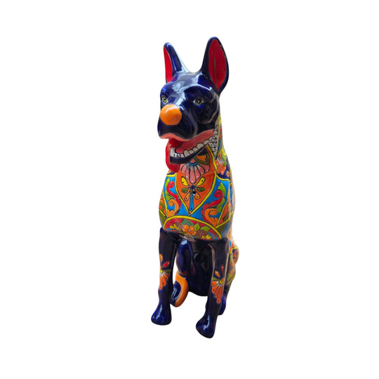 The Talavera Hub handmade Mexican ceramic dog statue with vibrant hand-painted floral patterns and a glossy blue finish.