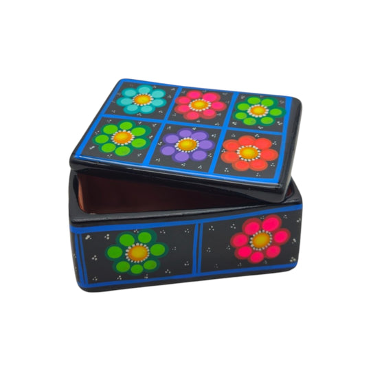 The Talavera Hub handcrafted Mexican ceramic jewelry box with vibrant hand-painted floral patterns on a black background.