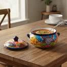 The Talavera Hub handmade Mexican ceramic soup pot with lid, hand-painted floral design in vibrant orange, blue, and yellow.