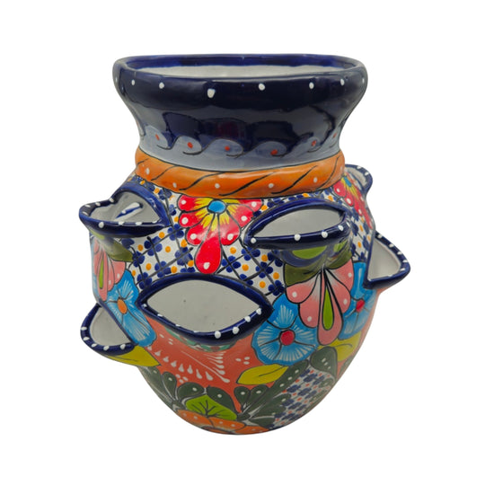 The Talavera Hub hand-painted Mexican ceramic strawberry planter with vibrant floral and geometric patterns.