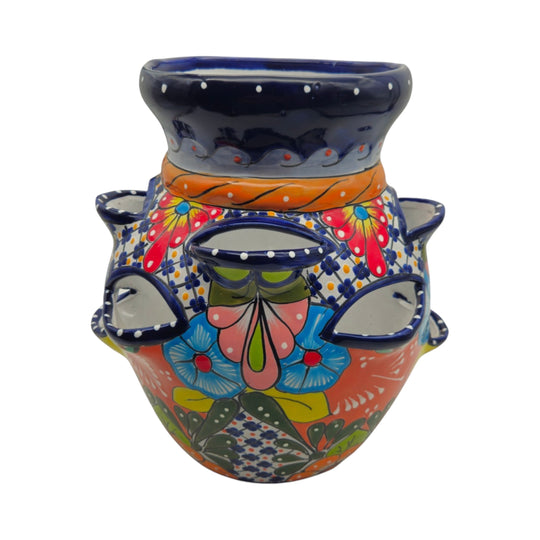 The Talavera Hub hand-painted Mexican ceramic strawberry planter with vibrant floral and geometric patterns.