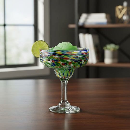 The Talavera Hub hand-blown Mexican margarita glass with colorful pebbled confetti design and clear stem.