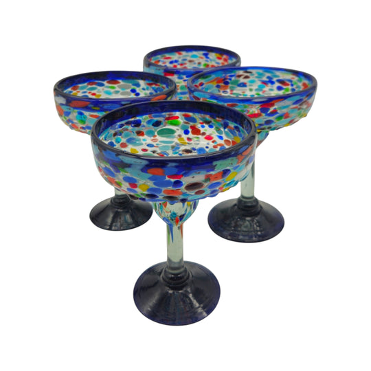 The Talavera Hub Mexican hand-blown margarita glasses with blue confetti rock design and dark blue bases.
