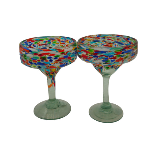 The Talavera Hub hand-blown Mexican margarita glasses with colorful pebbled confetti design on clear glass stems.