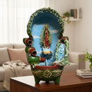 The Talavera Hub handcrafted Mexican outdoor fountain with a painted figure, blue and white accents, and water spouts.