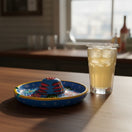 The Talavera Hub Mexican handmade Guerrero pottery bar glass rimmer with vibrant hand-painted floral patterns.