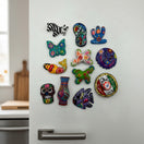 The Talavera Hub assorted hand-painted Guerrero pottery magnets featuring colorful Mexican folk art designs on a fridge