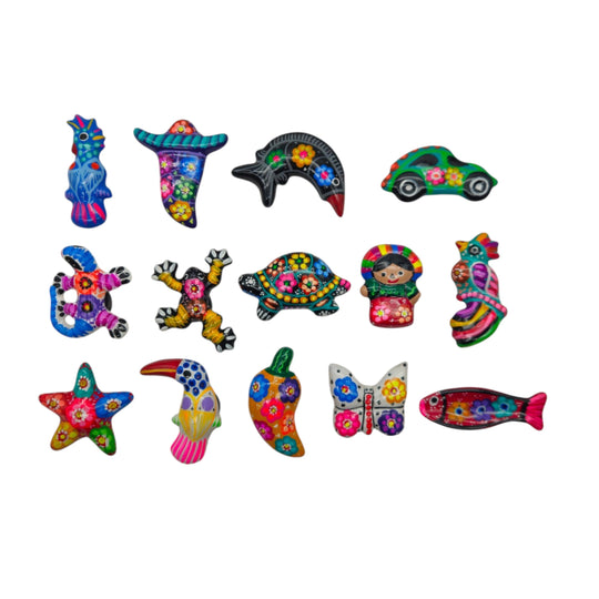 The Talavera Hub assorted hand-painted Mexican Guerrero pottery magnets featuring colorful animals and shapes.