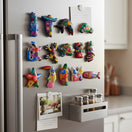 The Talavera Hub assorted hand-painted Guerrero pottery magnets featuring colorful Mexican animal and floral designs.