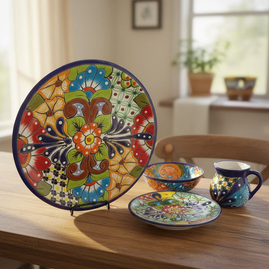 The Talavera Hub 34-piece handmade Mexican Talavera dinnerware set for 8, featuring vibrant floral patterns in blue, orange, red, and green.