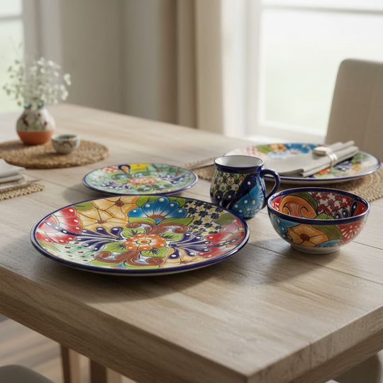 The Talavera Hub 34-piece dinnerware set for 8, featuring hand-painted floral designs in vibrant colors on ceramic.