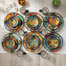 The Talavera Hub 26-piece dinnerware set with vibrant floral Mexican Talavera pottery. Includes plates, bowls, and mugs.