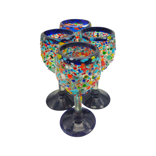 The Talavera Hub hand blown Mexican wine glasses with blue rim and colorful confetti design. Lead-free glass.