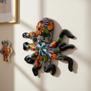 The Talavera Hub large handmade octopus wall art, hand-painted with vibrant floral Talavera designs on black glaze.