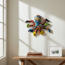 The Talavera Hub large handmade octopus wall art, hand-painted Talavera ceramic with vibrant floral and geometric patterns in blue, red, yellow, green, and orange.