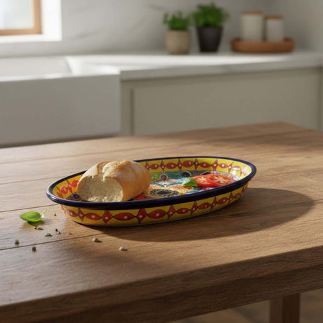 The Talavera Hub oval ceramic serving platter with a cobalt-blue rim and vibrant hand-painted Mexican patterns.